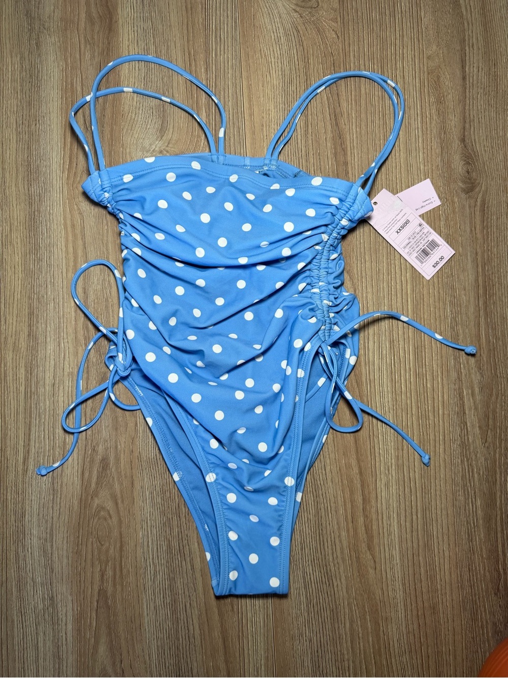 Women’s Blue Polka Dot One-Piece Swimsuit with Adjustable Side Ties
